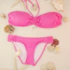 Solid pink bikini bottom with standard bikini coverage in lightweight quick-drying polyamide.