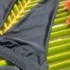 Triangle bikini top in polyamide with light unpadded cups and a waist band that wraps and ties to set the fit.
