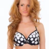 Black and white polka dot underwire bikini top with unpadded soft cups and fine straps over the shoulders.