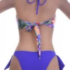 Floral bandeau bikini top worn as halter or strapless with a tie back in rich purple tones.