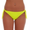 Signal yellow tie-side bikini bottom in a bright shade that catches the light against sand and sea, ties at each hip.