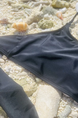 Soft swim bralette bikini top in polyamide with a tie-back band, a relaxed low-key shape for tanning and swimming.