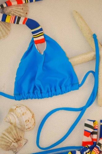 Turquoise triangle bikini top with light unpadded cups and a small multicolor tab at the center for contrast.
