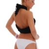 White bikini bottom with bold side bows tied at each hip, a moderate front and a cheeky back.