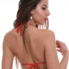 White and red lace-print triangle bikini top with light unpadded cups and slim red ties at the neck and back.