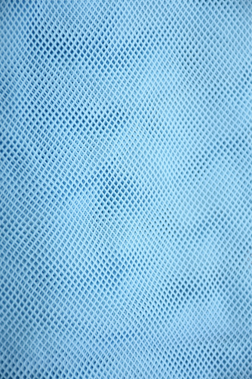 Blue sheer mesh short sarong by Tiara Galiano, a lightweight rectangular wrap that ties over a swimsuit at the hips.