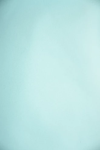 Emerald sheer mesh short sarong by Tiara Galiano, a lightweight rectangular wrap that ties over a swimsuit at the hips.