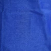 Light blue sheer mesh short sarong by Tiara Galiano, a lightweight rectangular wrap that ties over a swimsuit at the hips.