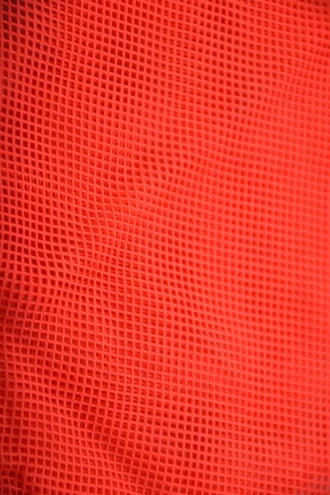 Red sheer mesh short sarong by Tiara Galiano, a lightweight rectangular wrap that ties over a swimsuit at the hips.
