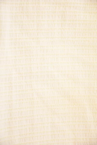 Yellow sheer mesh short sarong by Tiara Galiano, a lightweight rectangular wrap that ties over a swimsuit at the hips.