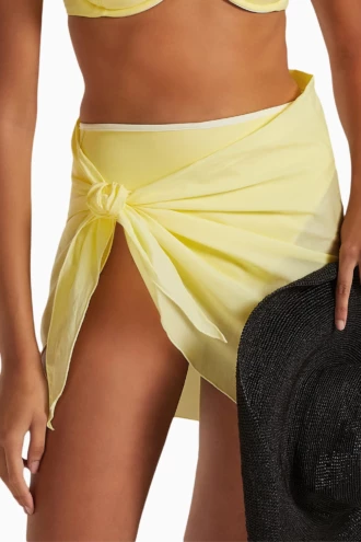 Sheer yellow mesh sarong wrap for women, one-size airy beach cover-up that knots low on the hips by the pool.